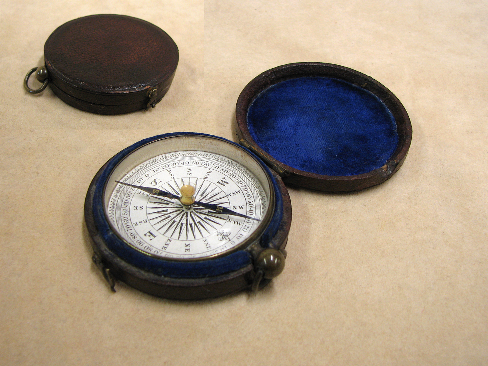 Early Victorian pocket compass in leather covered outer case circa 1860